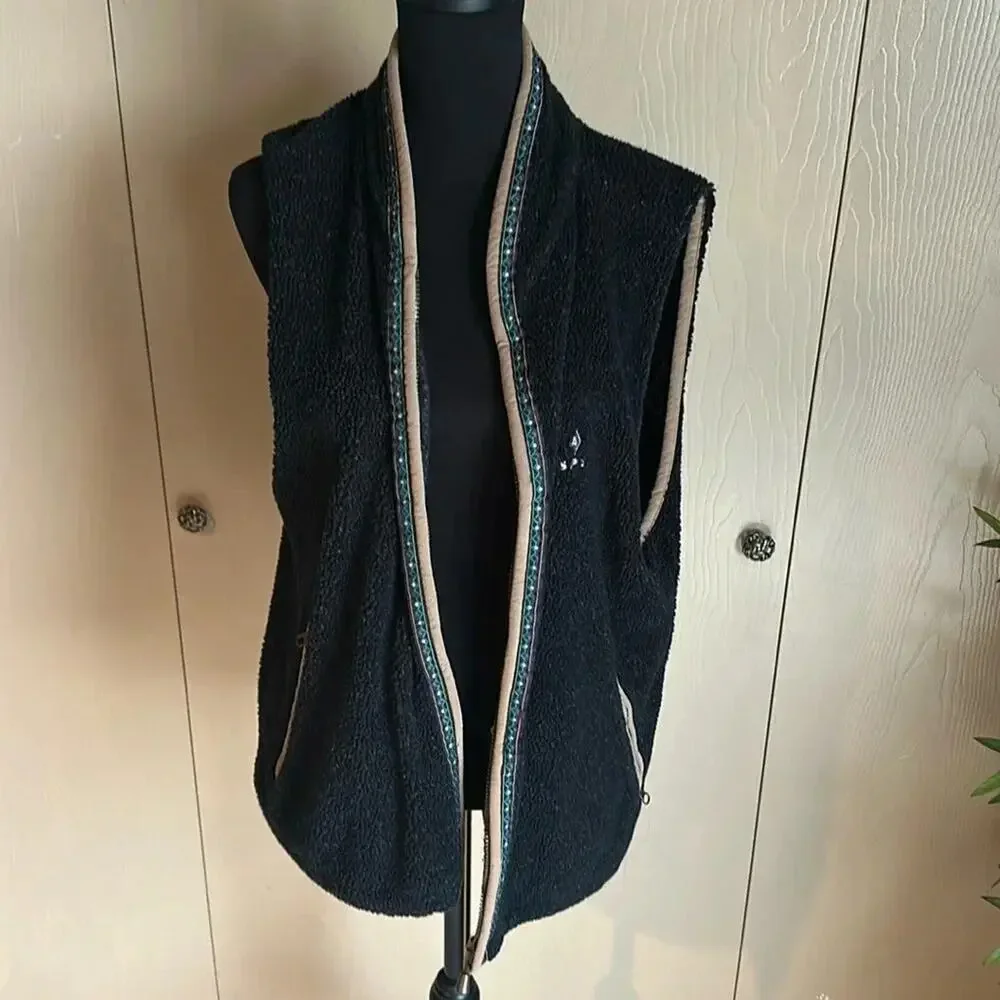 Leather trimmed fleece vest.